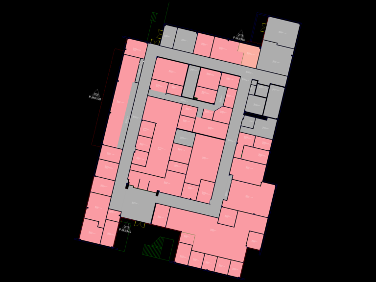 Color-coded CAD floor plan of an administration building with labeled office suites, corridors, and facility zones.
