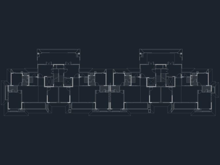 Architectural floor plan showing symmetrical residential units with central stairs, elevators, and balconies.