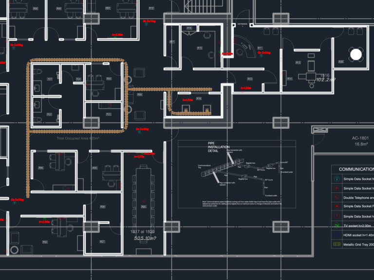 Office communications floor plan with metallic grid tray routing, data socket symbols, and pipe installation detail.