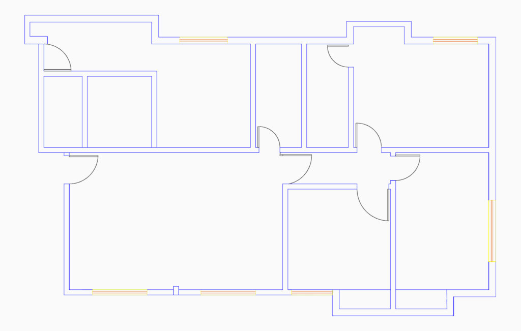 2D CAD floor plan showing blue masonry wall lines, door swings, and window openings for a residential unit.
