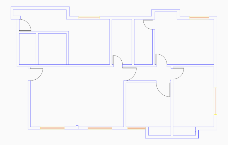 2D CAD floor plan showing blue masonry wall lines, door swings, and window openings for a residential unit.