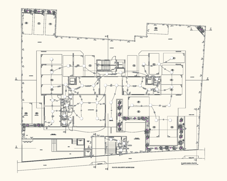 Electrical floor plan for a residential building pilotis level showing lighting circuits and wiring layout.