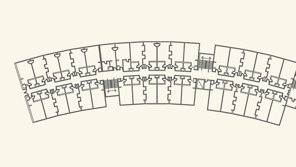 Curved architectural floor plan of hotel guest rooms and corridor with stairwells.