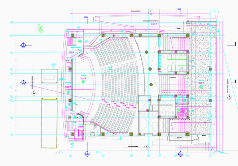 Architectural CAD floor plan of an auditorium with curved seating, stage, foyer area, and technical storage rooms.