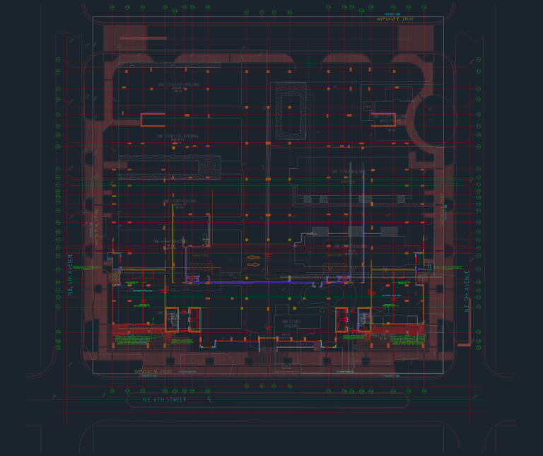 CAD floor plan of a retail building showing structural grid, property lines, and commercial tenant build-out layout.