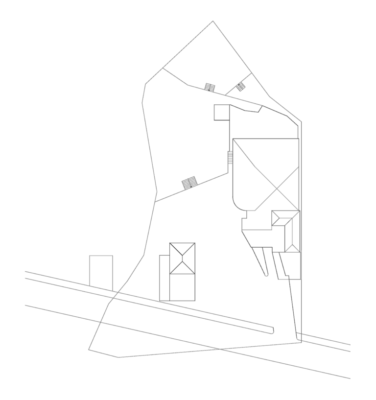 CAD site plan showing residential building footprints, roof plan outlines, plot boundaries, and terrain stairs.