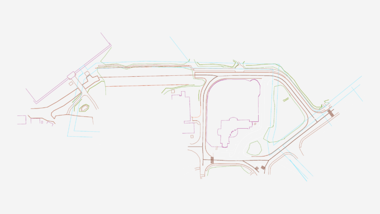 Civil site layout CAD drawing showing road alignments, building footprints, and topographic contours.