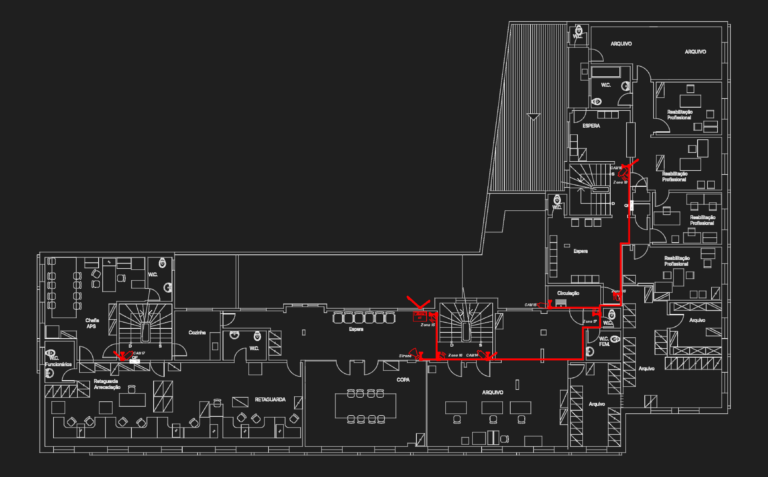 Office floor plan with security system layout showing CCTV camera placements and alarm wiring in red.