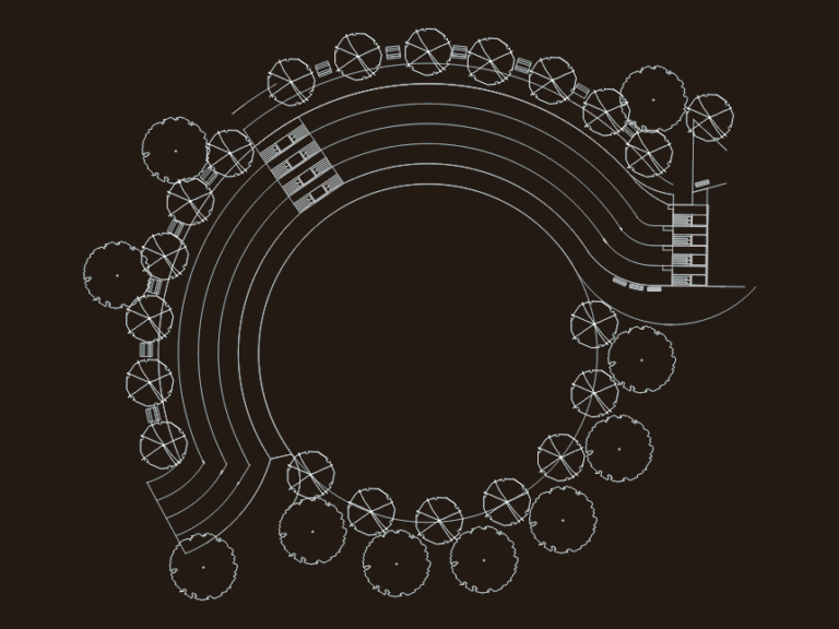 CAD site plan for a children's center featuring a circular track, landscape trees, and civil grading elevations.