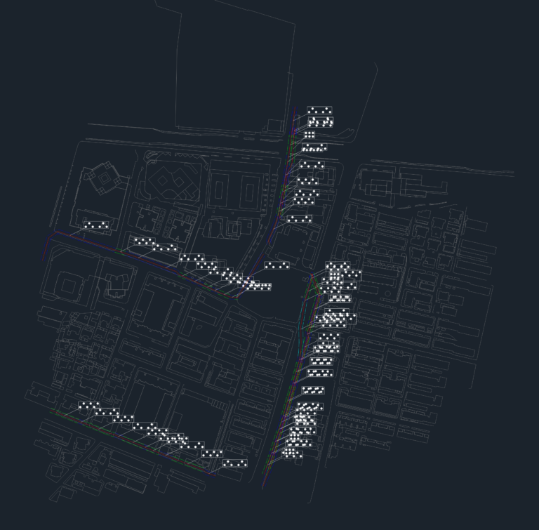 Top-down urban planning CAD map of a city block with building footprints, roads, and utility lines.