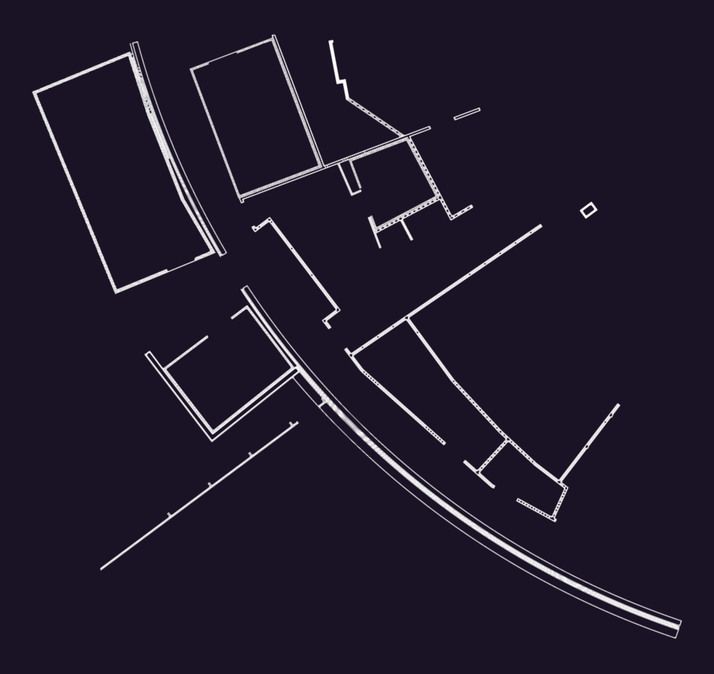 CAD floor plan showing building partitions and a curved site boundary line.