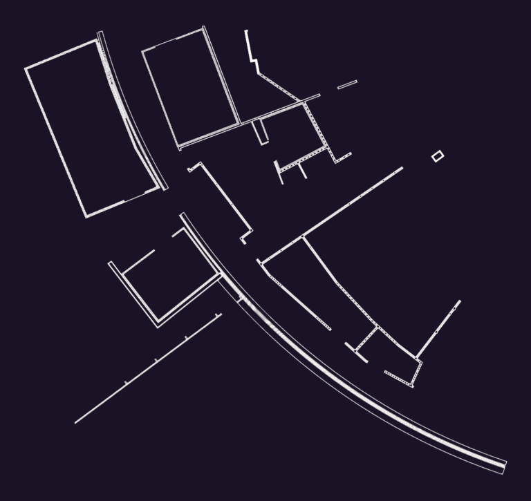 CAD floor plan showing building partitions and a curved site boundary line.