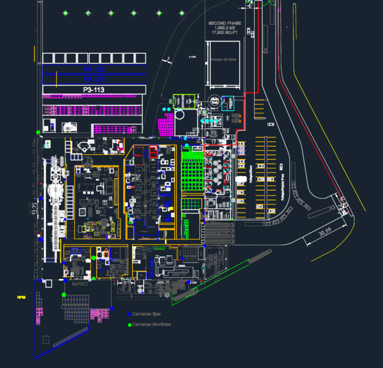 CAD floor plan of a large industrial manufacturing facility with production equipment, storage, and parking.