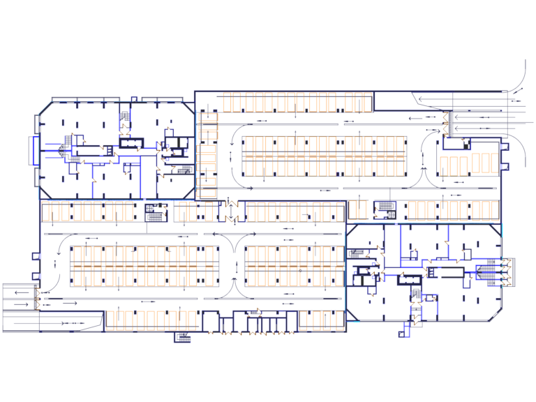 2D CAD floor plan of a large parking garage layout with parking stalls and traffic flow arrows.