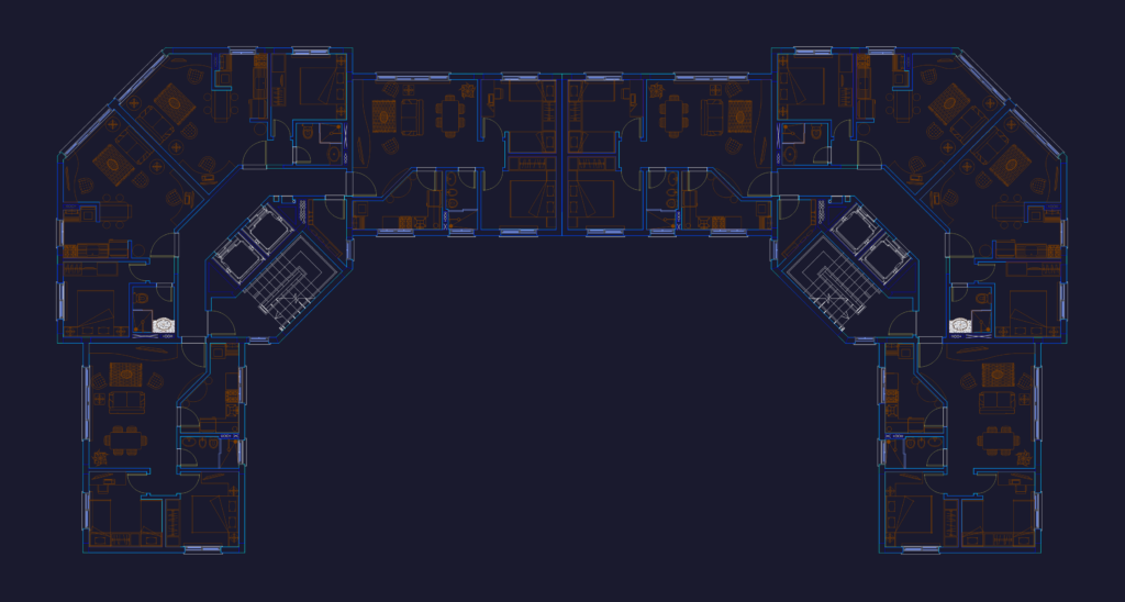 Plan of a U-shaped residential building showing apartment layouts with furniture, bathrooms, and elevator shafts.