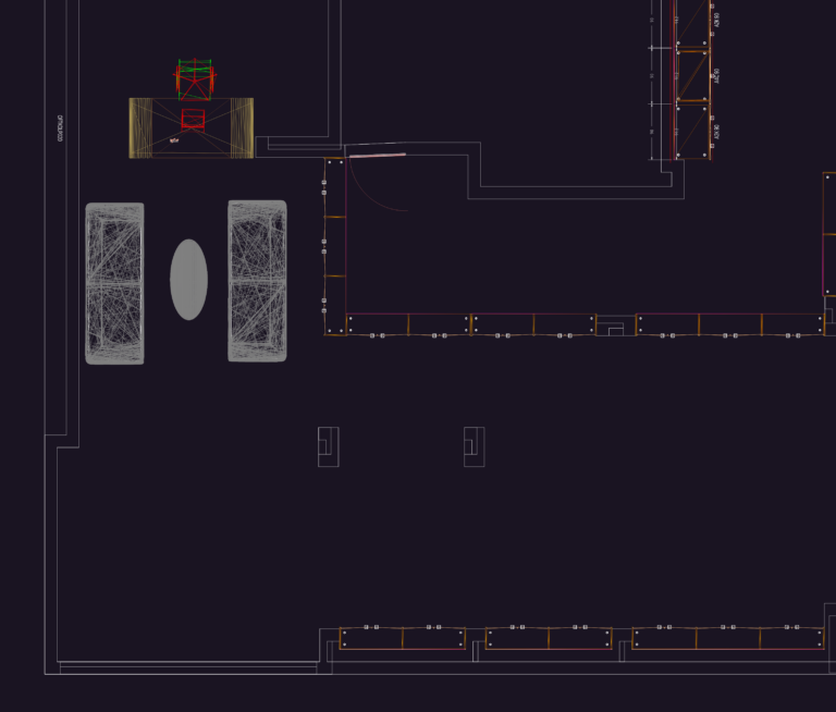 Architectural floor plan showing office furniture, desks, sofas, and detailed wall-mounted cabinetry units.