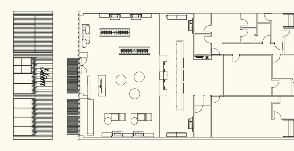 Architectural floor plan of a retail showroom with display furniture, office partitions, and facade details.