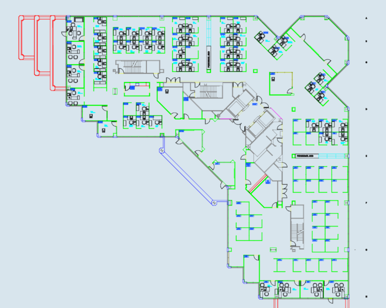 2D CAD floor plan of a corporate office with cubicles, desks, stairs, and structural grid lines.