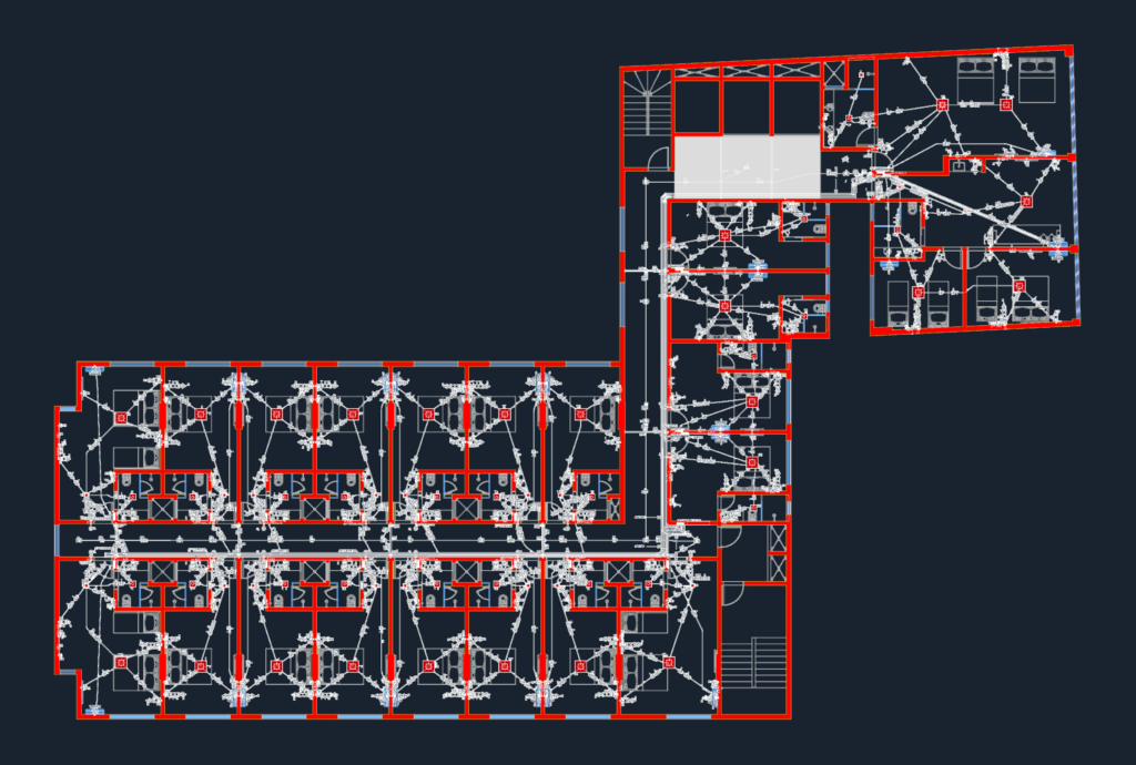 Electrical floor plan of a hotel guest floor with apartment layouts and electrical circuit diagrams.
