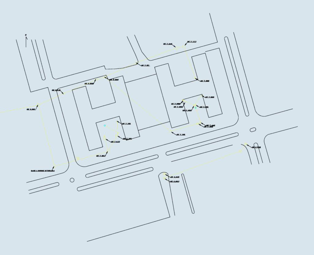 Site plan of a sewage network with manholes, pipe connections, and elevation data.